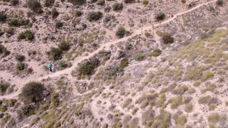 Sportsmen-ziplining-aerial-view-of-sportsman-in-zipline-amidst-mountain-in-Murcia,-Spain