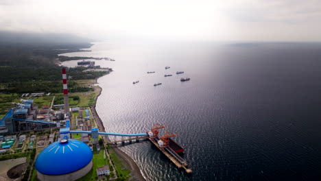 Big-industrial-Celukan-Bawang-power-station-on-Bali-coastline,-aerial-view