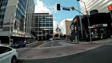 Motorcyclist-first-person-point-of-view-driving-through-dense-city