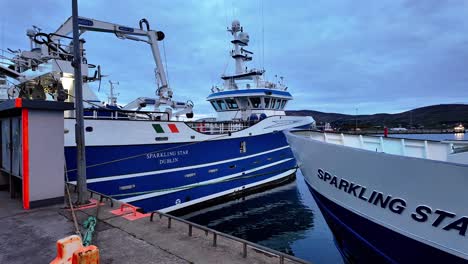 Ireland-Epic-Locations-large-fishing-boats-back-from-sea-moored-in-Castletownbere-Harbuur-Cork-on-a-summers-evening