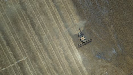 Birdseye-Shot-Of-Tractor-Harvesting-Wheat,-Grain-Harvest-Industry,-Esperance-Area,-Western-Australia