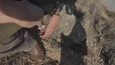 Soldier-taking-the-machine-gun-in-the-field