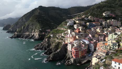 Riomaggiore-Cinque-Terre-Italy-aerial-scenic-village-set-on-ocean