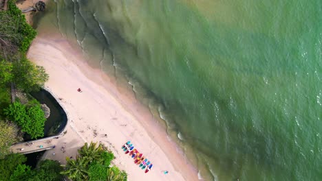 Breathtaking-view-of-ao-nang-beach-with-turquoise-water,-white-sand,-and-lush-green-cliffs,-Kayak-paddle-boats-in-krabi,-thailand