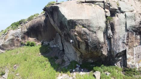 People-rappelling-in-a-wild-area-of-​​Rio-de-Janeiro,-Brazil,-South-America