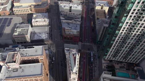 Oakland-CA-USA,-Revealing-Drone-Shot,-Traffic-on-Broadway-and-Telegraph-Avenue,-Cathedral-Building