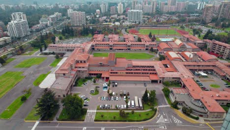 Aerial-tracking-shot-of-the-O'Higgins-Military-school-in-cloudy-Santiago-de-Chile