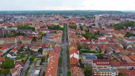 Soaring-through-skies-above-Szombathely,-Hungary-ancient-capital,-on-drone-flight