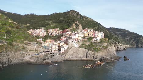 Manarola-Cinque-Terre-Italy-aerial-low-angle-approaches-the-village