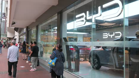 A-pedestrian-walks-past-the-Chinese-automaker-BYD-official-authorized-car-dealer-store