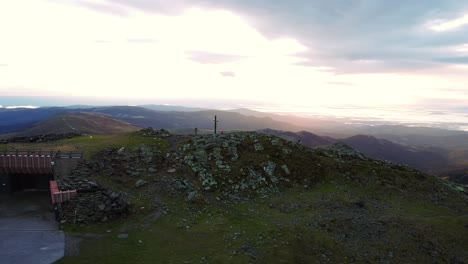 A-breathtaking-aerial-view-of-the-Grosser-Speikkogel-weather-station,-captured-at-sunrise