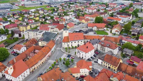 Aerial-view-of-Slovenska-Bistrica-city,-Slovenia-with-architecture-buildings,-rooftops,-city-road-and-traffic