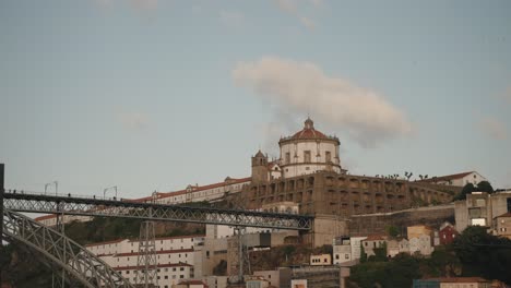 View-of-the-Mosteiro-da-Serra-do-Pilar-and-Dom-Luís-I-Bridge-in-Porto,-Portugal-during-daylight