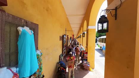 Walking-along-the-storefronts-in-Las-Bovedas-in-Cartagena,-Columbia