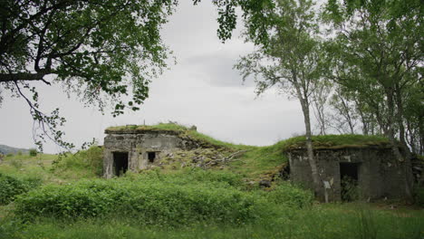 Coastal-bunker-with-two-doors-in-static-shot-under-cloudy-sky