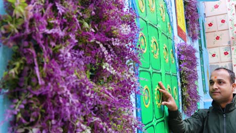 man-experiencing-artistic-wall-art-painting-at-blue-city-street-at-morning-from-unique-angle-video-is-taken-jodhpur-rajasthan-india