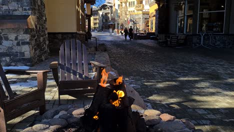 Fire-Pit-on-Gas-in-Palisades-Ski-Resort,-Lake-Tahoe-USA-on-Cold-Sunny-Winter-Day