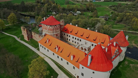 Aerial-medieval-castle-and-palace-Bauska-Castle-in-Latvia,-drone-video