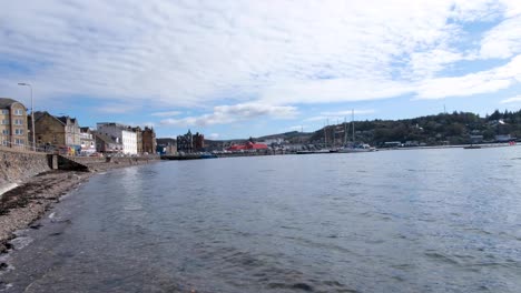 Scenic-view-overlooking-harbour-water-in-popular-holiday-destination-of-Oban-in-Scotland-UK