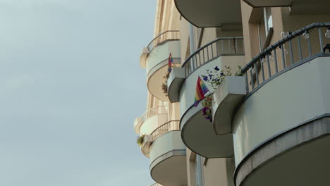 Pride-flags-on-balconies-in-the-sunlight-in-Oslo