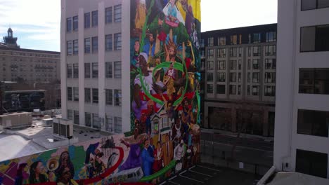 Aerial-View-of-Ascendance-Mural-on-Greenlining-Institute-Building-in-Downtown-Oakland,-California-USA