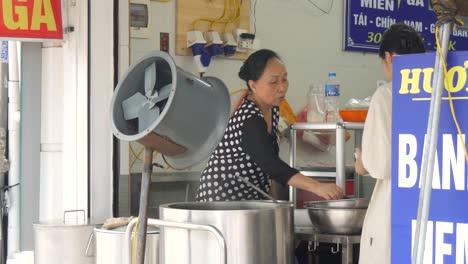 Street-kitchen,-customer-service,-urban-business,-healthy-broth-bowl-Pho