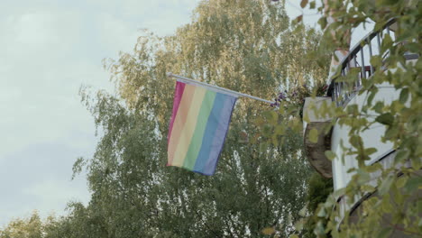 Pride-flag-on-a-balcony-in-Oslo-on-a-sunny-day