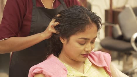 Shot-of-a-young-Asian-woman-getting-a-head-massage-in-a-spa-center,-health-care,-clear-skin