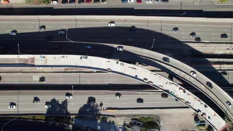 Overhead-aerial-of-interstate-highway-with-on-ramp-and-roadway-construction,-4K