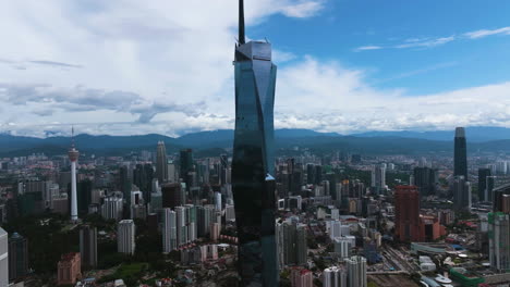 Establishing-drone-shot-of-the-Mederka-118-tower-in-Kuala-Lumpur,-Malaysia