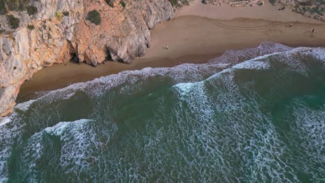 Waves-crashing-on-the-shoreline-at-the-Coast-and-Port-of-Ginesta-in-Barcelona