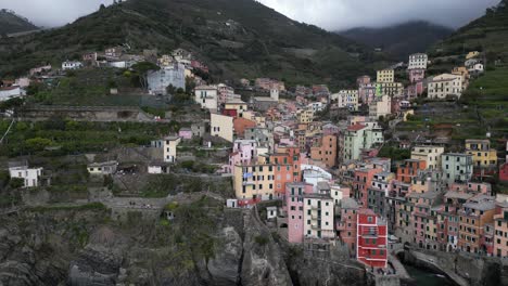 Riomaggiore-Cinque-Terre-Italy-aerial-smooth-rotating-view-of-the-buildings-on-the-cliffs