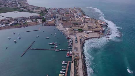 Aerial-establishing-Marzamemi-oceanfront-town-in-Sicily,-Italy