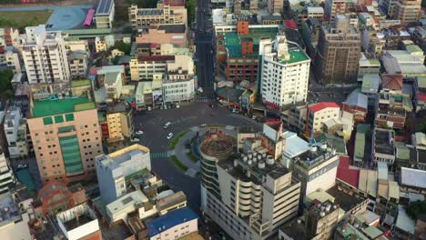 Aerial-birds-eye-view-drone-fly-around-Douliu-Circle,-the-iconic-landmark-roundabout-in-the-city-center,-Yunlin-county,-Taiwan