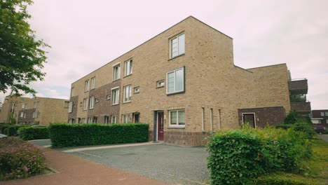 Footage-of-modern-brick-stone-design-square-apartments-and-houses-in-Lelystad,-Netherlands