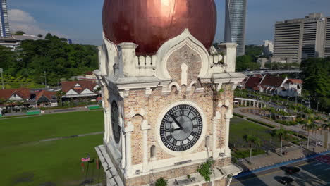 Aerial-view-around-the-clock-tower-at-the-Dataran-Merdeka-in-Kuala-Lumpur,-Malaysia