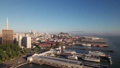 Gorgeous-sunrise-aerial-of-San-Francisco-waterfront-with-Coit-Tower,-4K