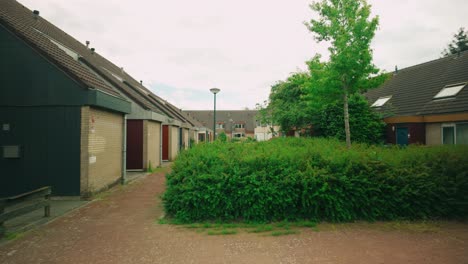 Footage-of-a-typical-60s-and-70s-residential-area-in-Lelystad,-showcasing-houses-and-garages