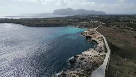 Drone-above-Favignana-island-coastline-Aegadian-Islands-aerial-Mediterranean-Sea