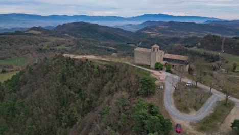 Historic-Church-of-Sant-Pere-de-Casserres-in-scenic-Barcelona-countryside,-aerial-view