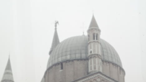 Basilica-of-Saint-Anthony-of-Padua-Dome-and-Bell-Tower-Under-Cloudy-Sky-in-1950s