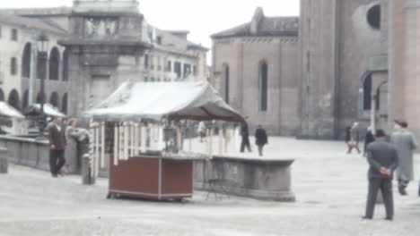 People-Shopping-at-a-Market-Stall-in-Front-of-a-Basilica-in-Padua-in-1950s