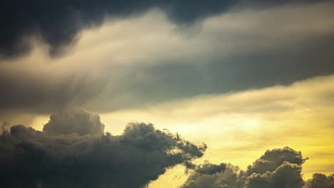 Timelapse-dark-storm-clouds-with-golden-bright-sunset-light,-beautiful-cloudscape