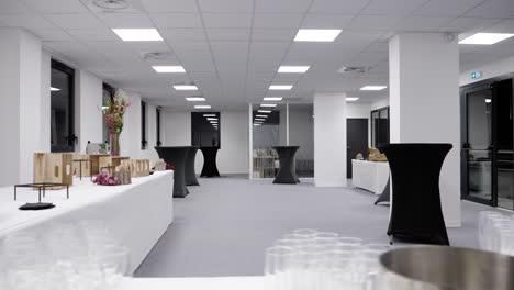 Slow-establishing-shot-of-a-caterer-setting-up-a-reception-in-a-small-event