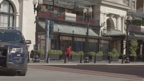 Grand-Rapids-police-vehicle-turning-the-corner-in-downtown-Grand-Rapids,-Michigan-is-slow-motion