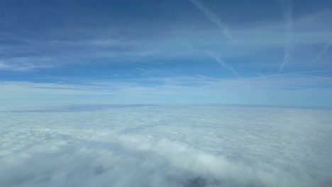 Pilot-POV-hyperlapse-at-supersonic-speed-flying-over-a-blanket-of-clouds