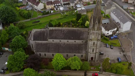 Saint-Michael's-Church-in-Ballinasloe-Galway,-drone-top-down-pullback-and-tilt-to-reveal-church