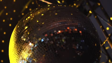 A-glittering-disco-ball-reflects-vibrant-lights,-creating-a-festive-atmosphere