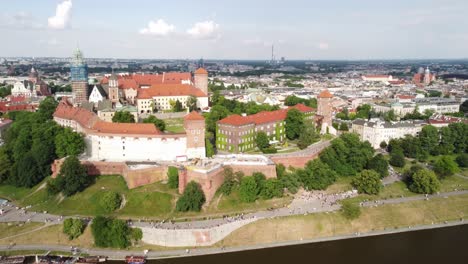 Drone-shot-of-Poland-old-cultural-heritage-sightseeing-landmark-Wawel-Royal-Castle-and-Museum-surrounded-by-rivers-and-marshes