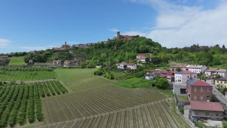 sweeping-aerial-arrival-at-Castello-di-Camino,-Piedmont,-Italy